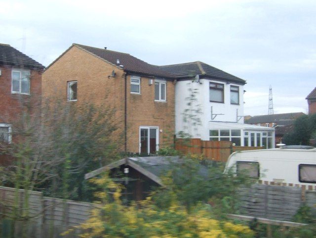Detached houses with gardens on a residential street in Yarm